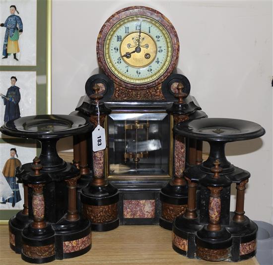 A black marble mantel clock and garniture